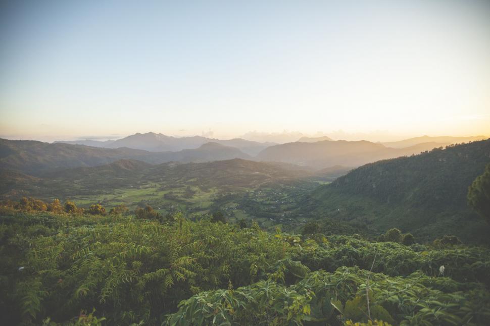 Free Image of Majestic Valley With Mountains in Background 