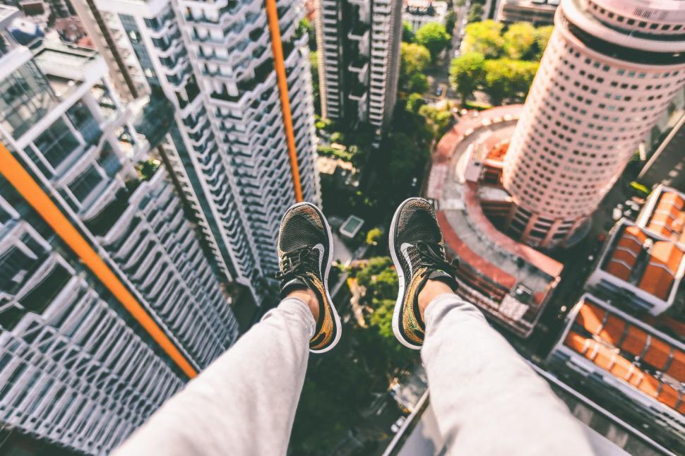 Free Image of Person Standing on Top of Tall Building 