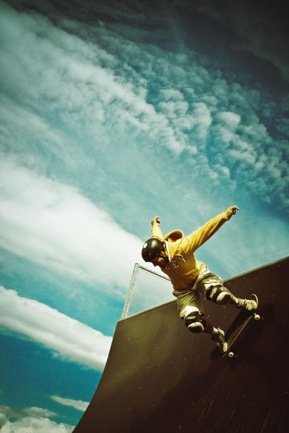 Free Image of Man Riding Skateboard Up Side of Ramp 