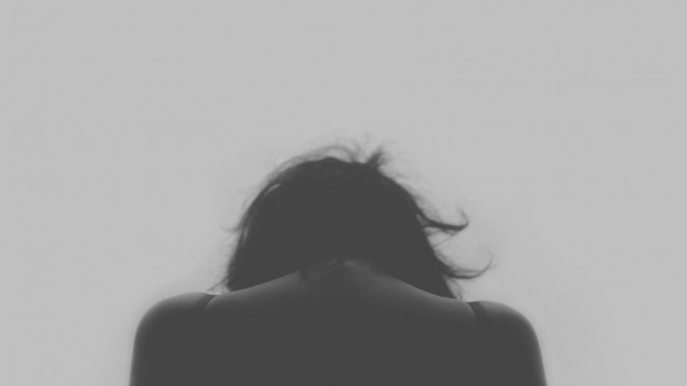 Free Image of Woman With Hair Blowing in Wind 