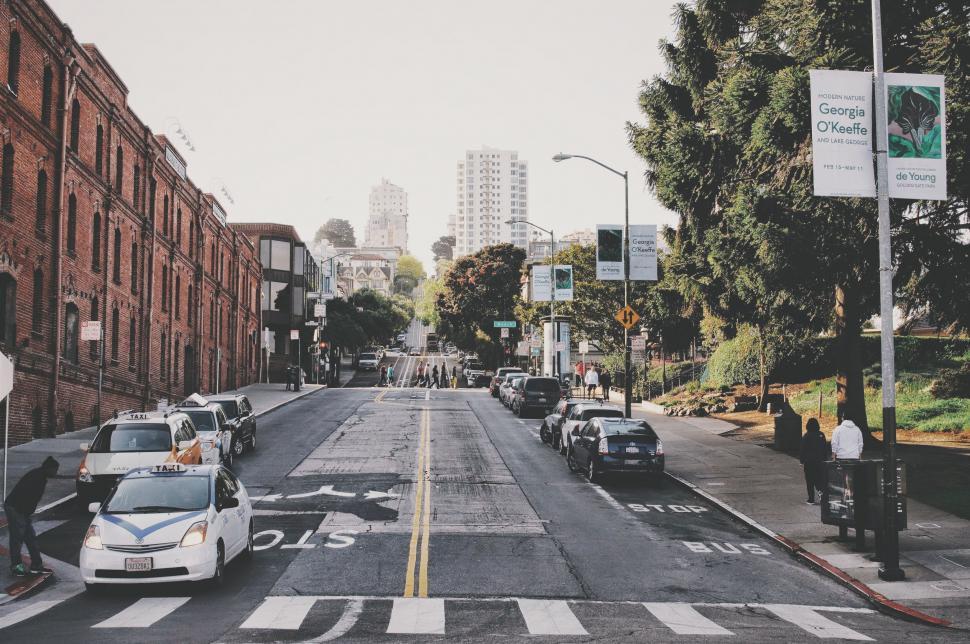Free Image of Bustling City Street Surrounded by Tall Buildings 