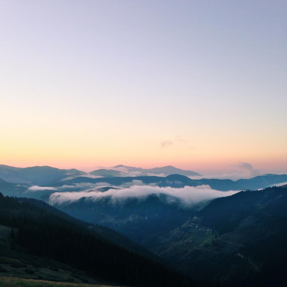 Free Stock Photo of Majestic Mountain Range Covered in Low Lying Clouds ...