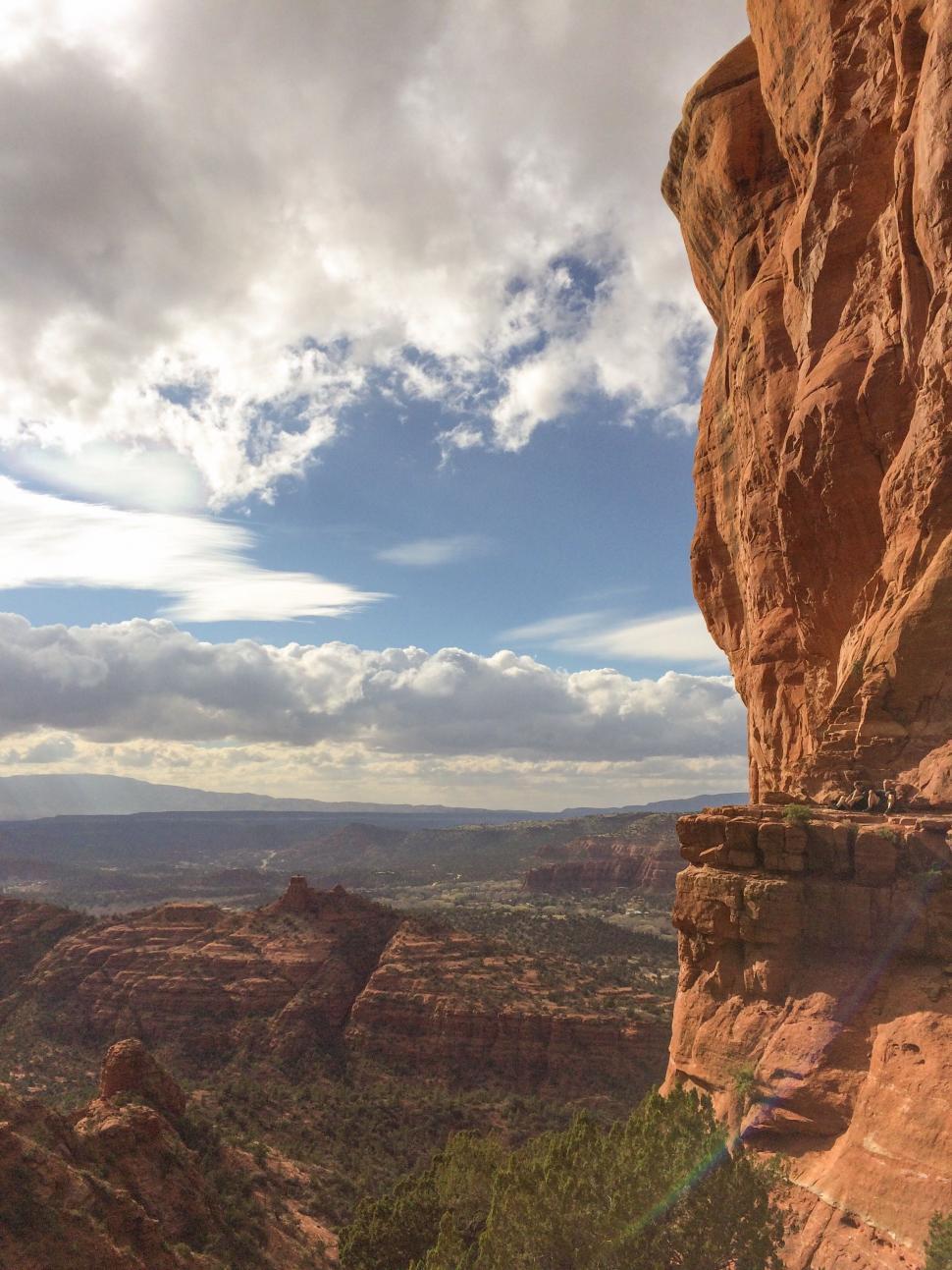 Free Image of Person Standing on Top of Cliff 