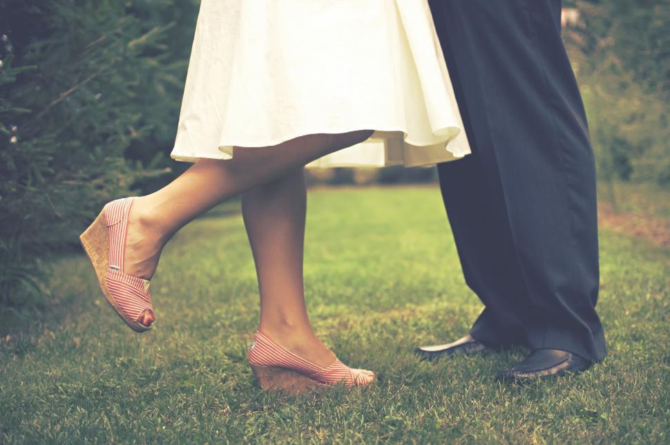 Free Image of Man and Woman Standing on Lush Green Field 