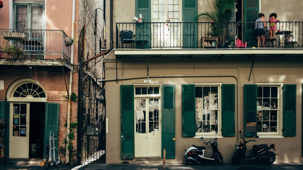 Free Image of Couple of Motorcycles Parked in Front of Building 