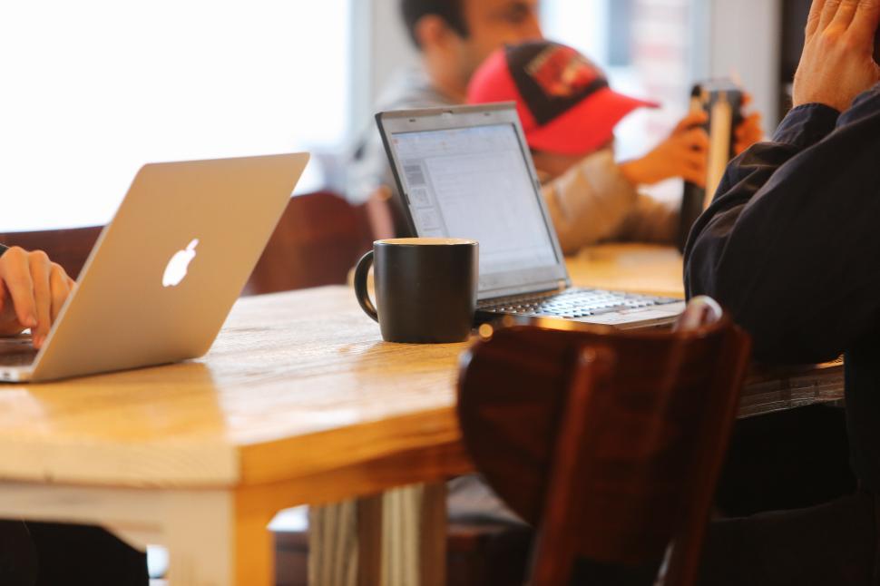 Free Image of People Working on Laptops at a Table 