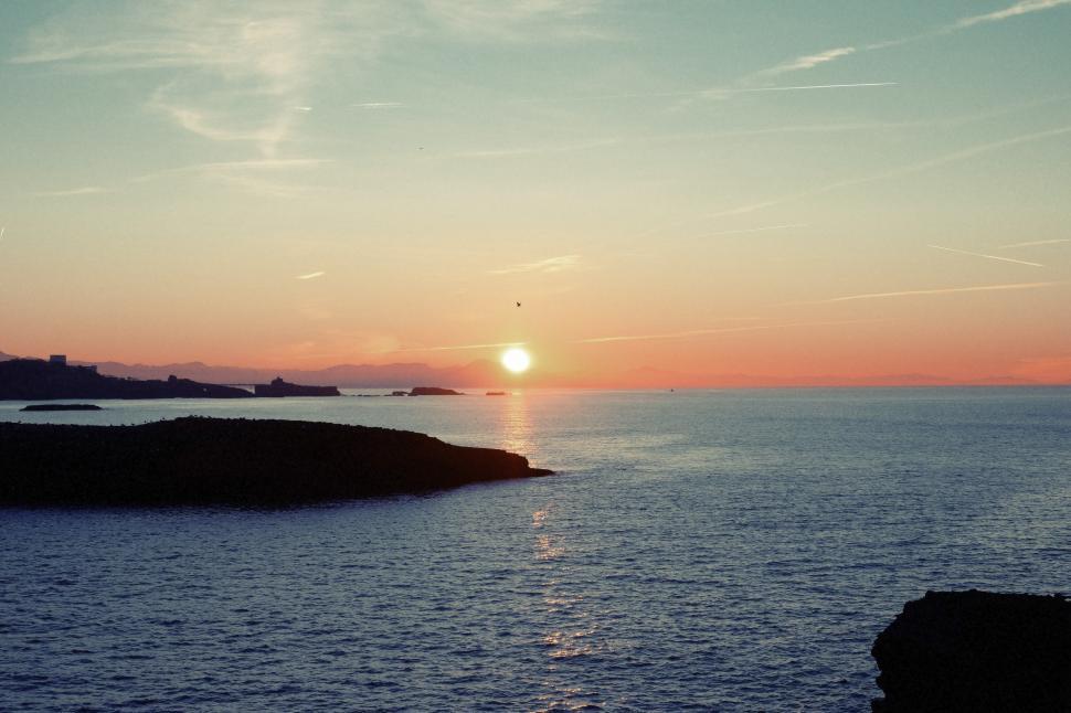 Free Image of Sunset Over a Body of Water 