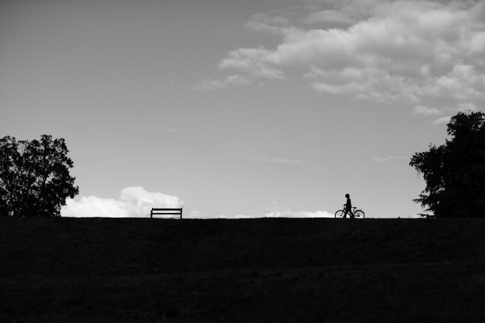 Free Image of Person Riding a Bike in Black and White 