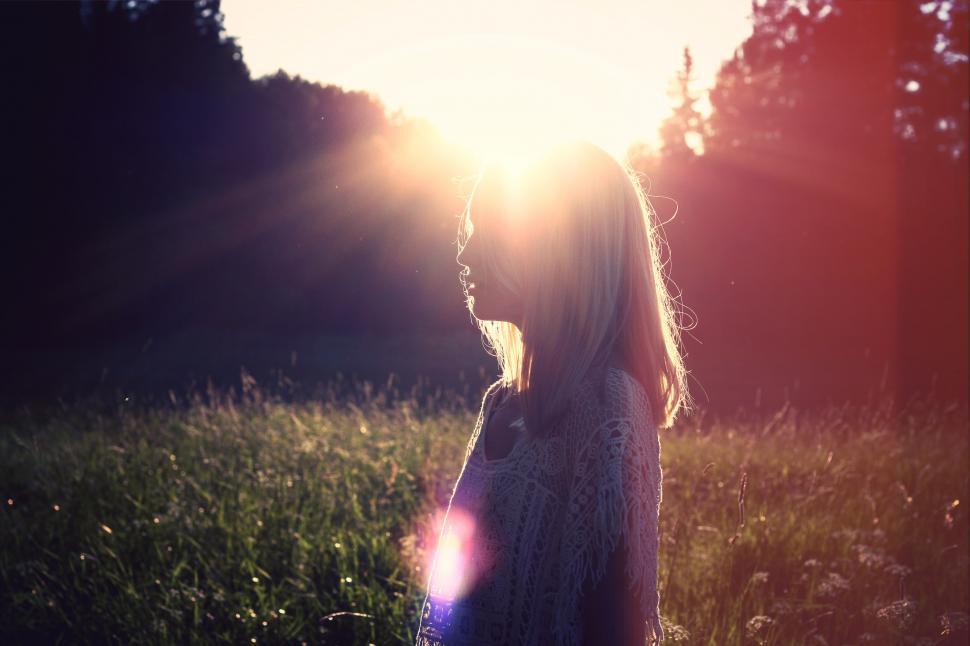 Free Image of Woman Standing in Field of Tall Grass 