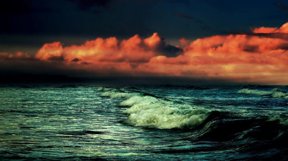 Free Image of Cloudy Sky Over Large Body of Water 