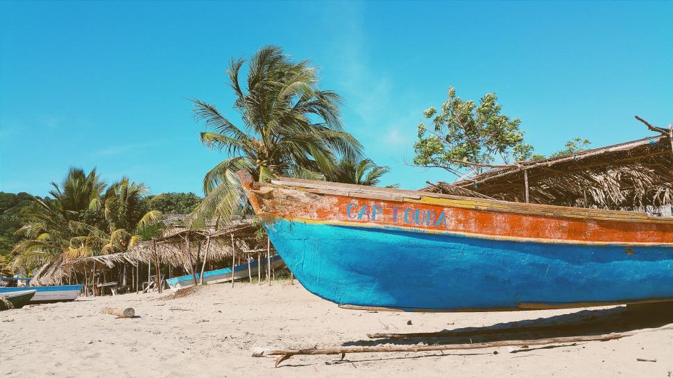 Free Image of Blue Boat on Sandy Beach 