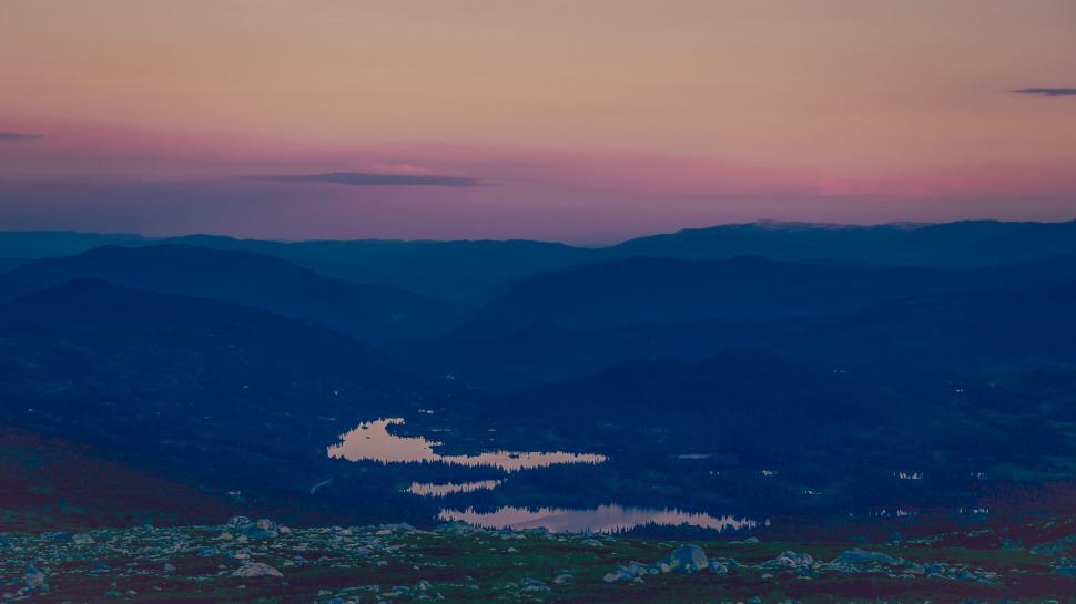 Free Image of A View of a Lake Surrounded by Mountain Range 