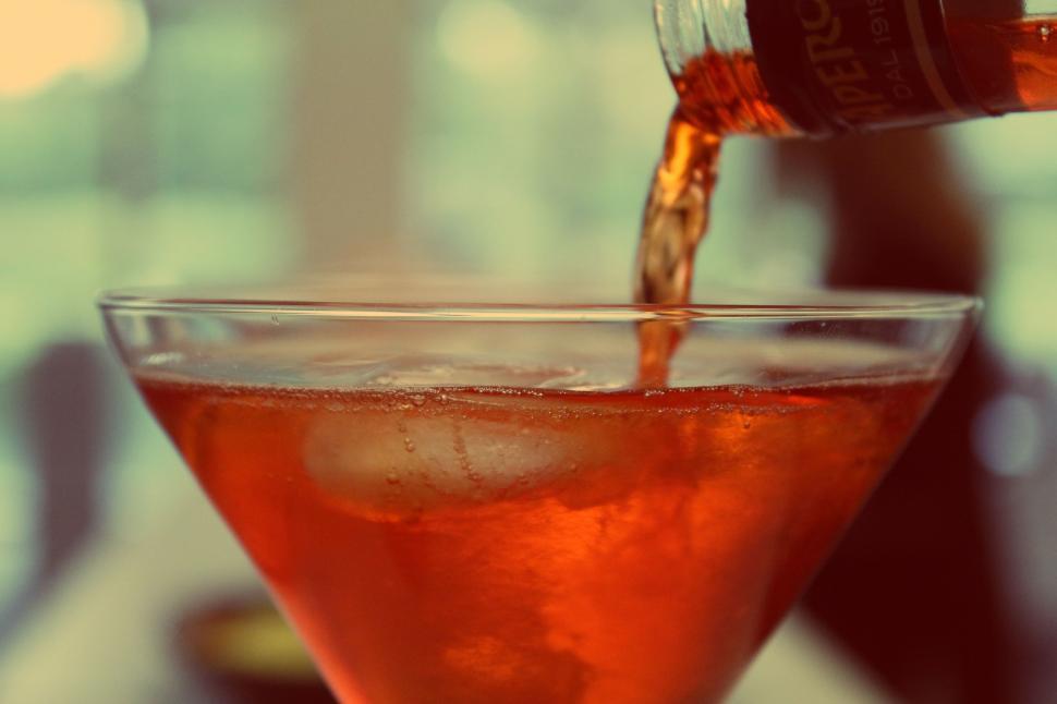 Free Image of Person Pouring Drink Into Glass 