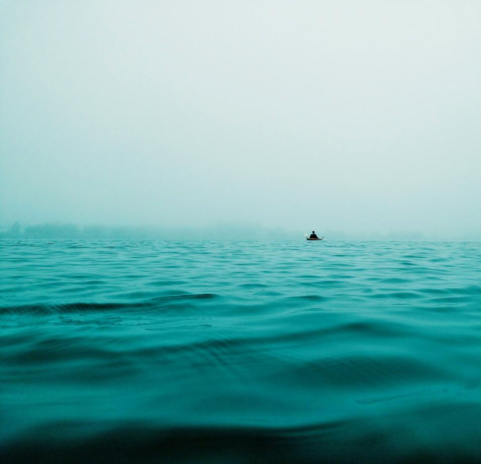 Free Image of Solitary Boat Adrift in Vast Ocean 