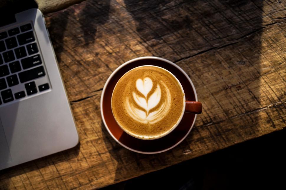 Free Image of A Cup of Coffee on a Wooden Table 