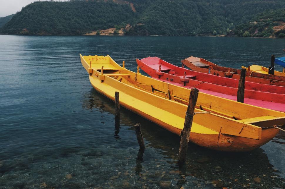 Free Image of Boats Aligned on Lake Surface 