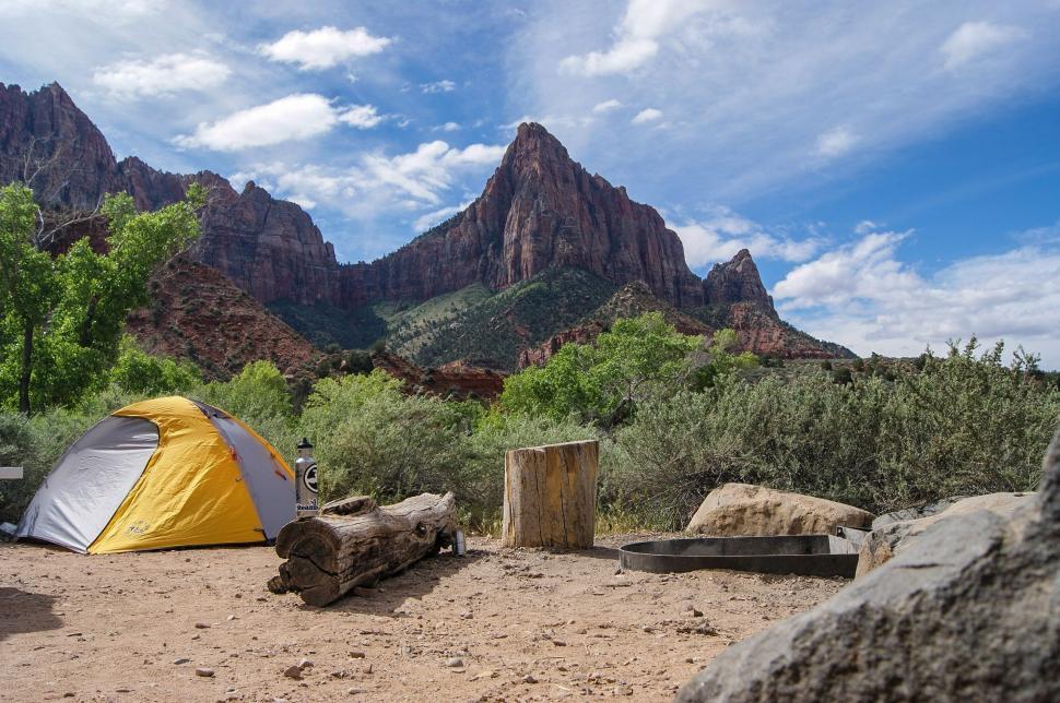 Free Image of Yellow and Gray Tent on Dirt Field 
