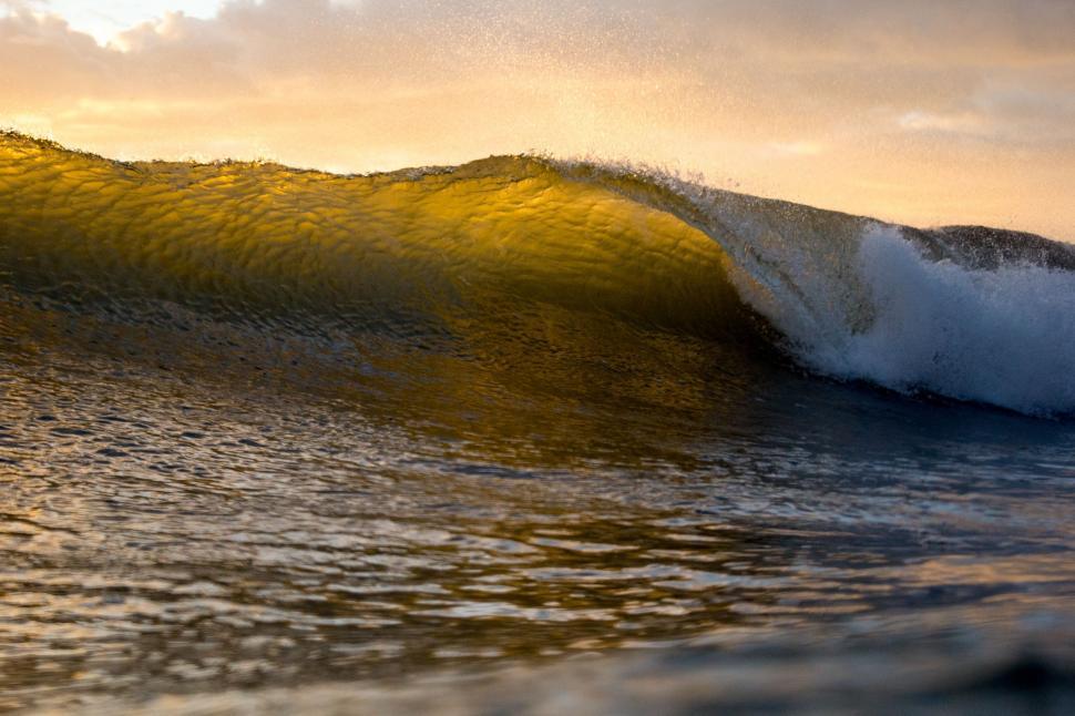 Free Image of Surfer Riding Large Wave in the Ocean 