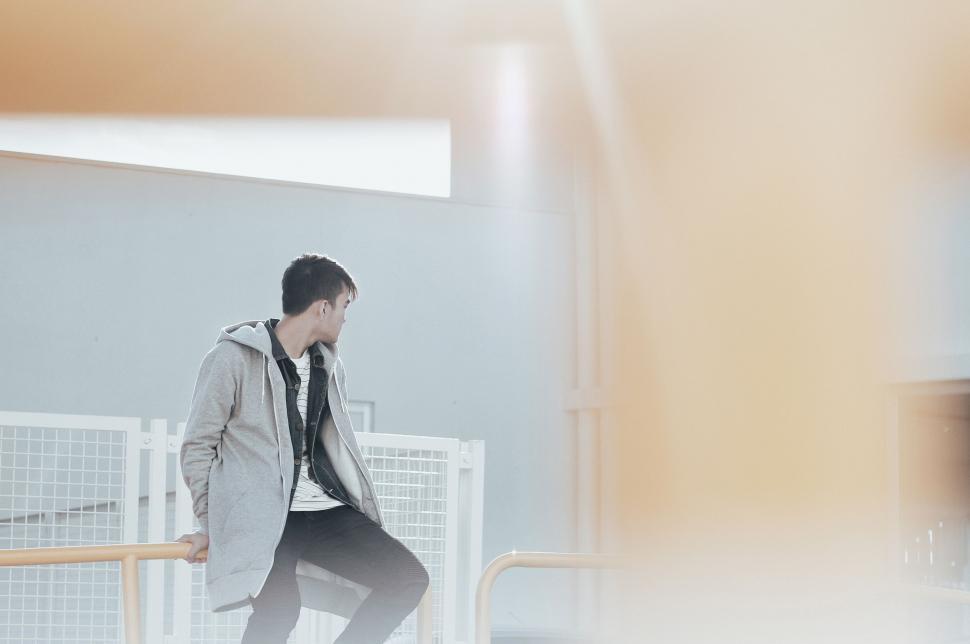 Free Image of Man Skateboarding in a Coat and Tie 