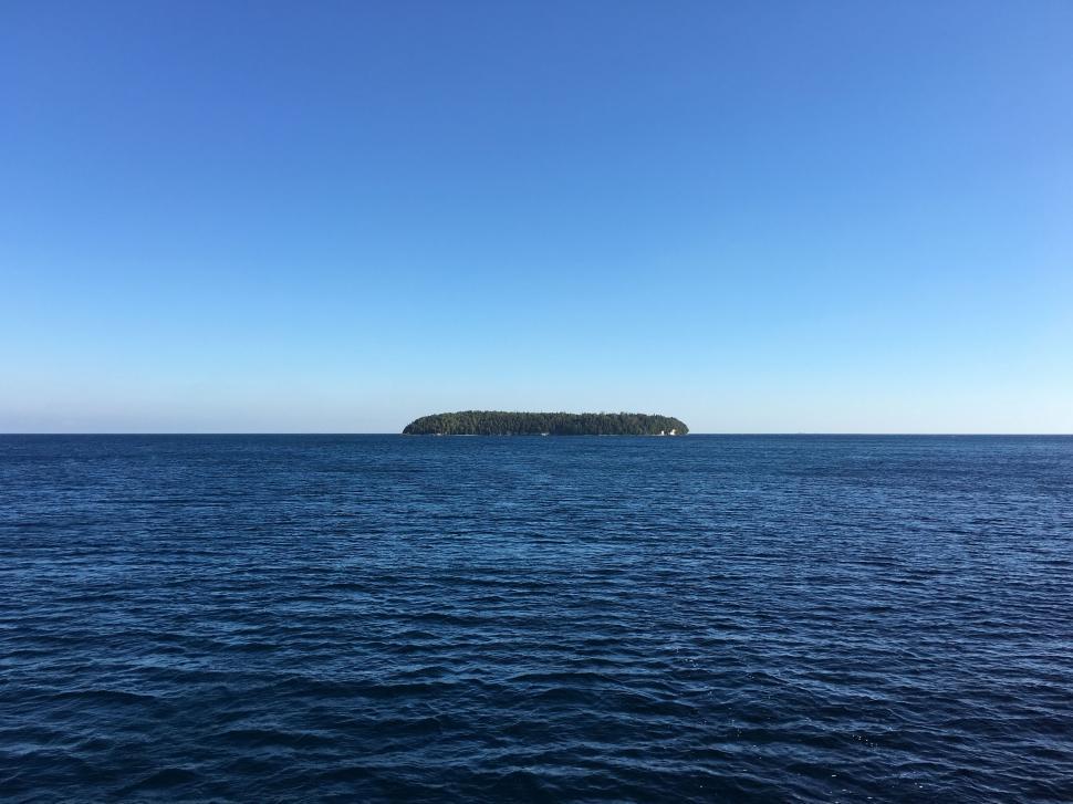 Free Image of Small Island in the Middle of the Ocean 