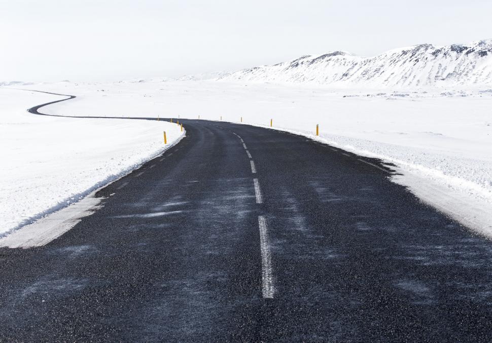 Free Image of A Black and White Photo of a Snowy Road 