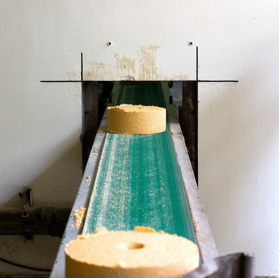 Free Image of Conveyor Belt With Two Rolls of Dough 