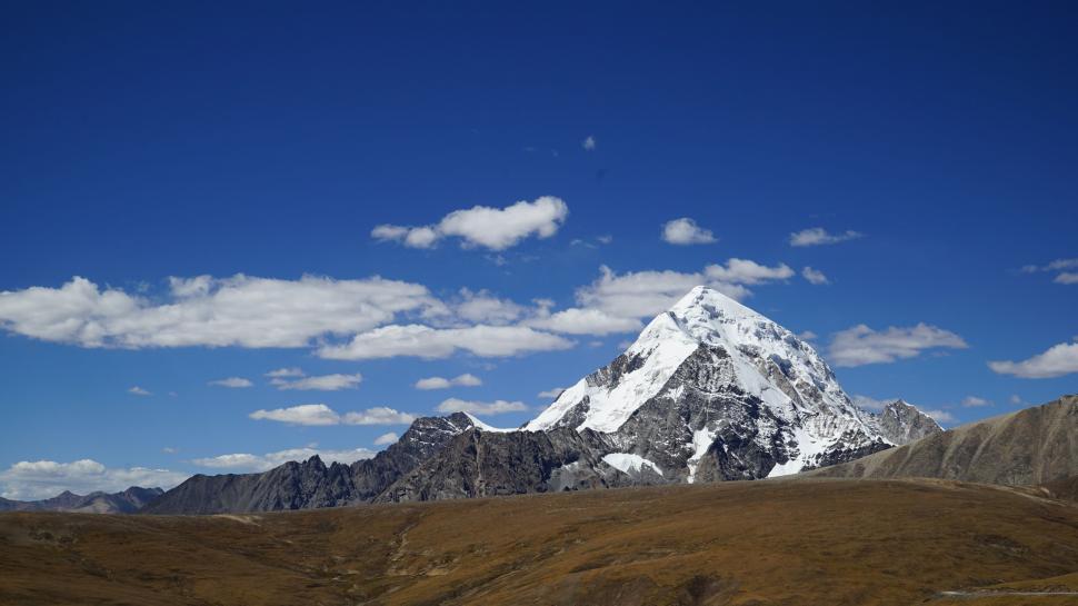 Free Image of Snow Covered Mountain Rising in Field 