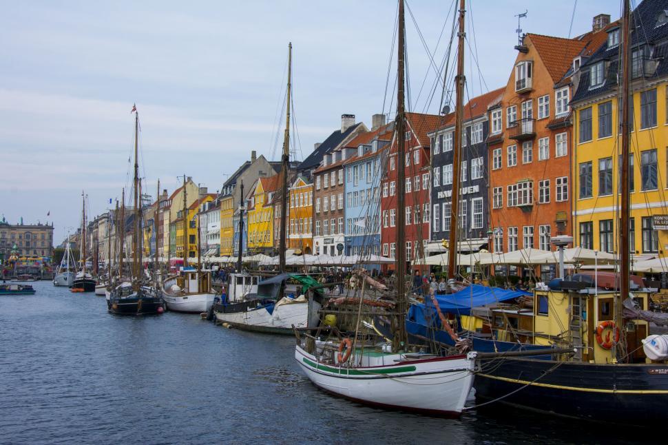 Free Image of Boats Filling Harbor Next to Tall Buildings 