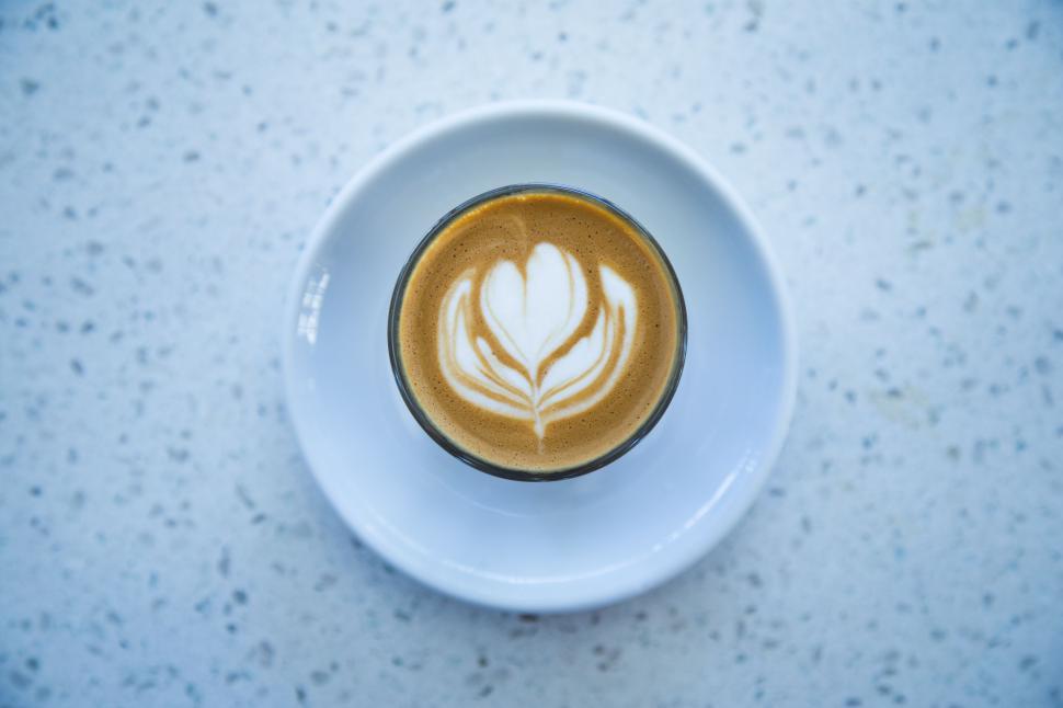 Free Image of A Cup of Coffee on a Saucer on a Table 