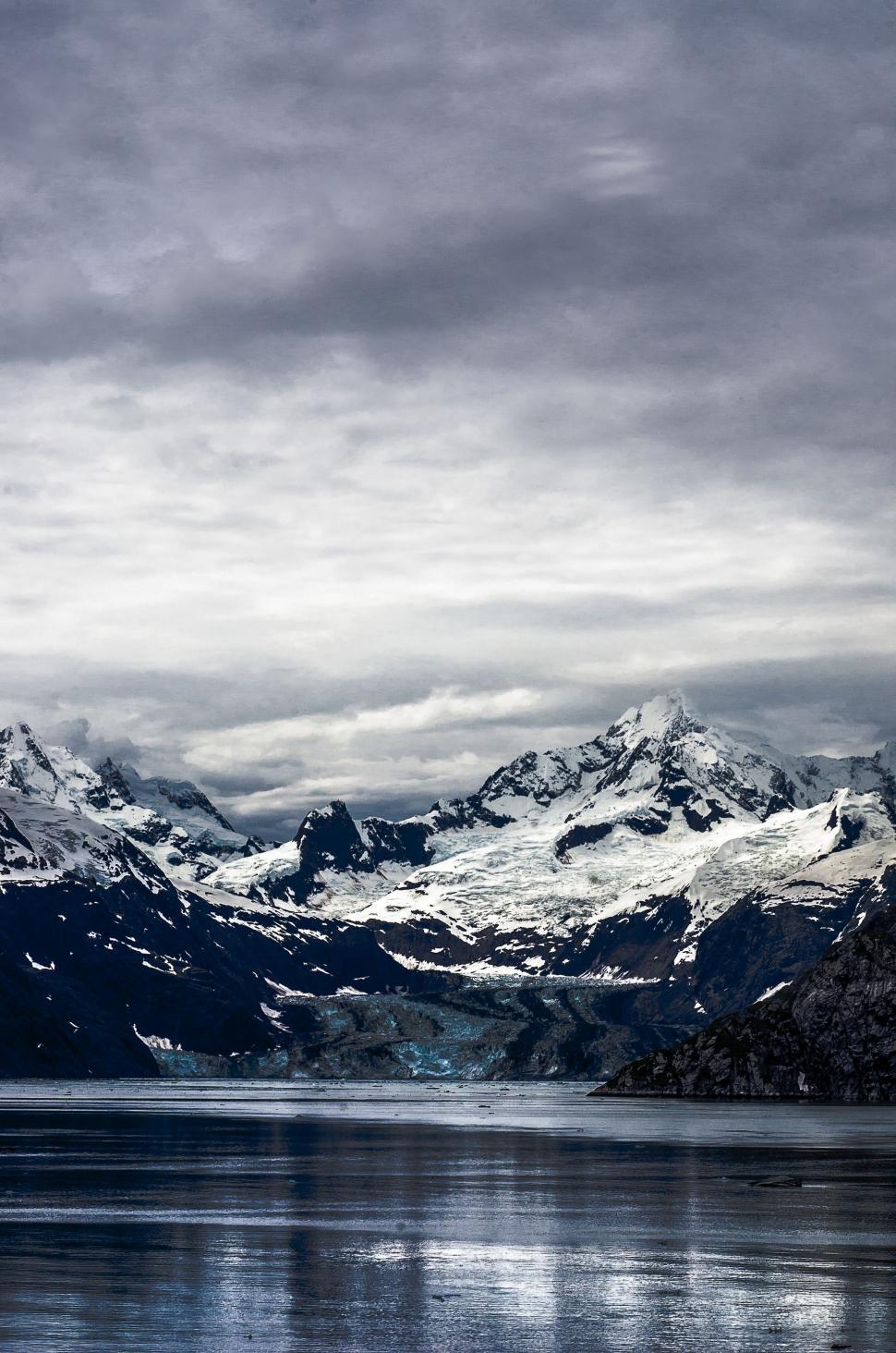 Free Image of Majestic Mountain Range Overlooks Vast Water Reservoir 