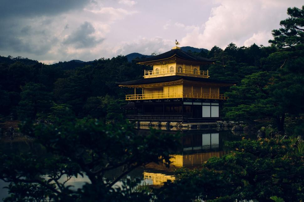 Free Image of Yellow Building Overlooking Green Hillside 