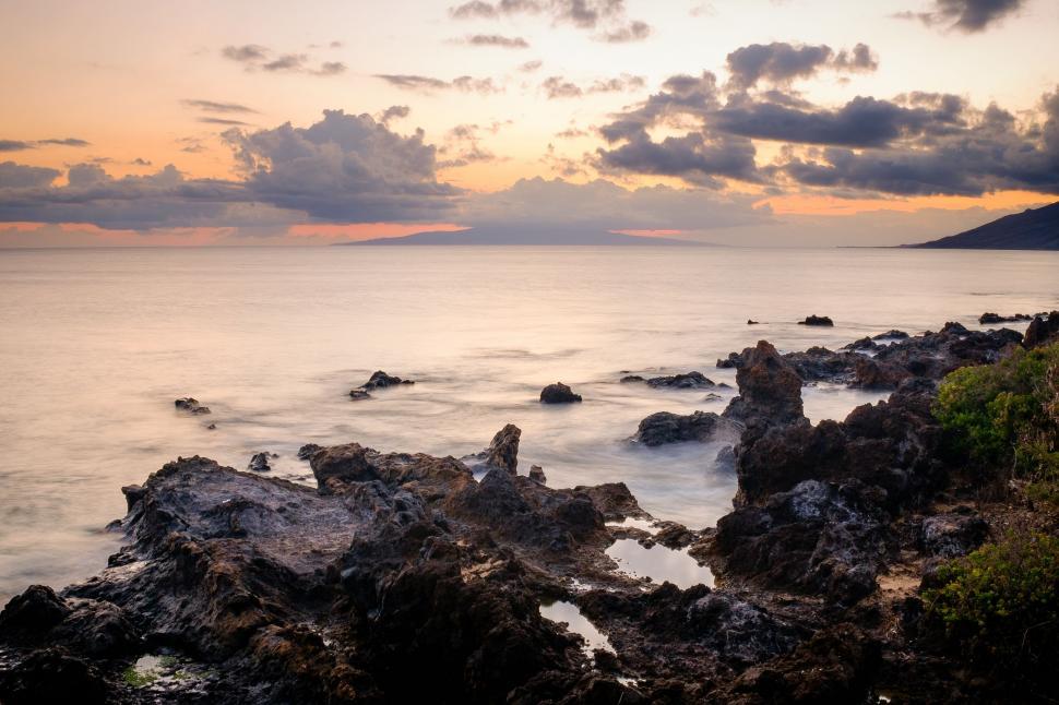 Free Image of Body of Water Surrounded by Rocks 