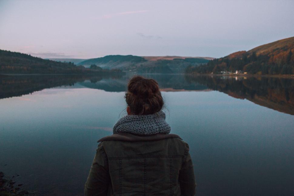 Free Image of Person Standing in Front of Body of Water 