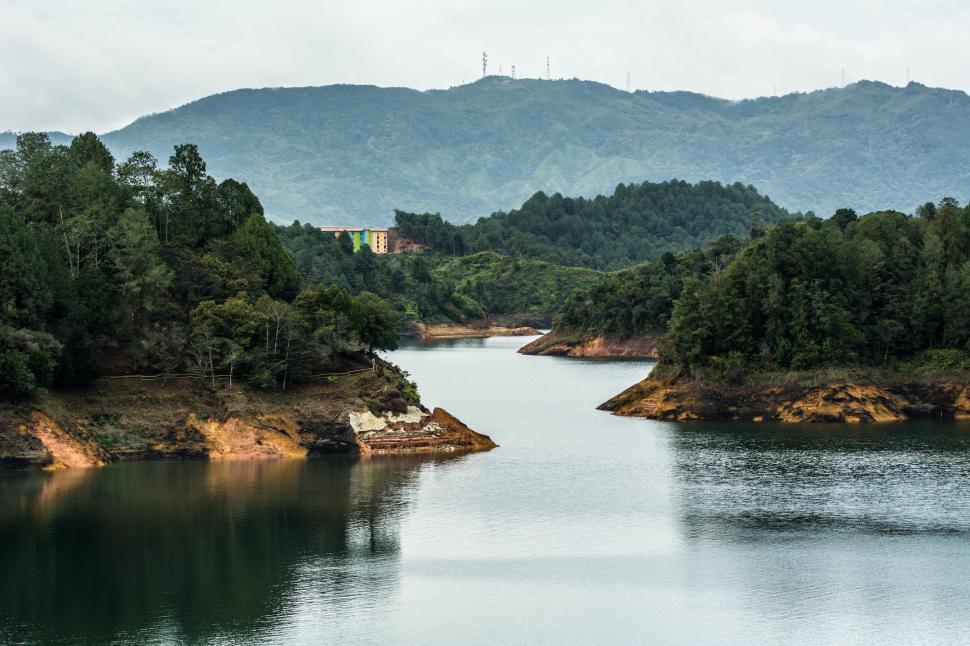 Free Image of Water Surrounded by Trees and Mountains 