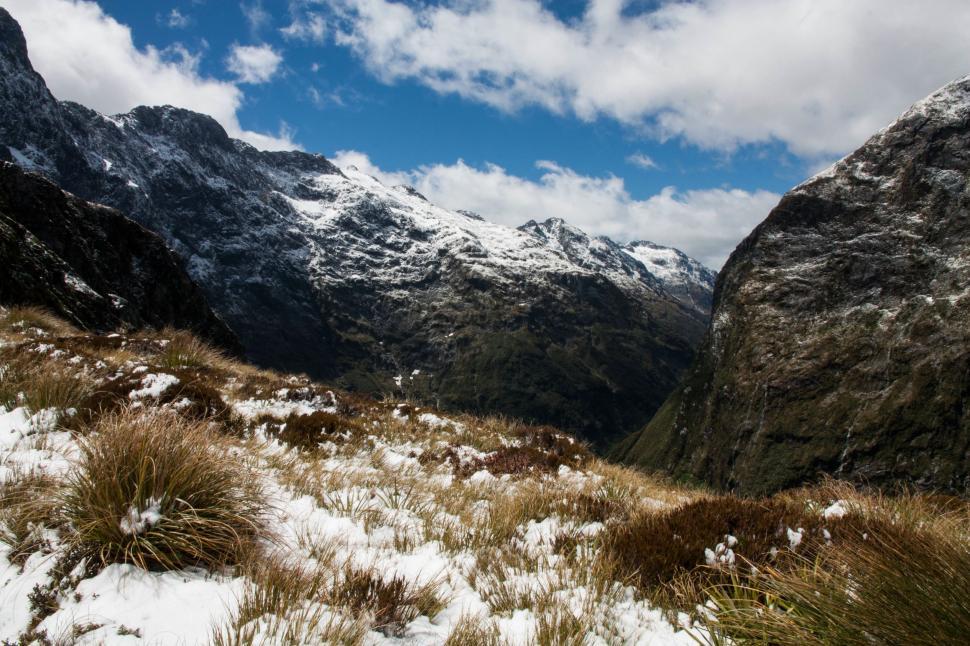 Free Image of Snow Covered Field With Mountain in Background 