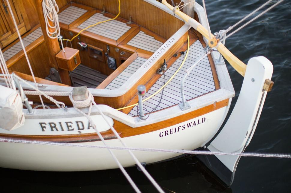 Free Image of Sailboat Tied Up to Dock in Water 