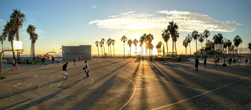 Free Image of Group of People Playing a Game of Basketball 