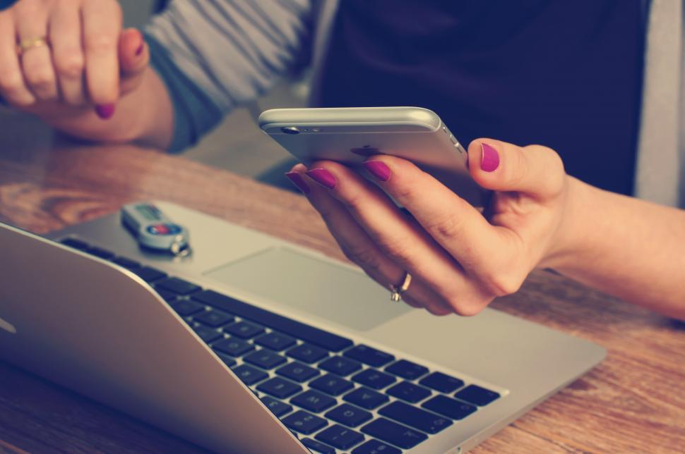 Free Image of Looking at smarphone 