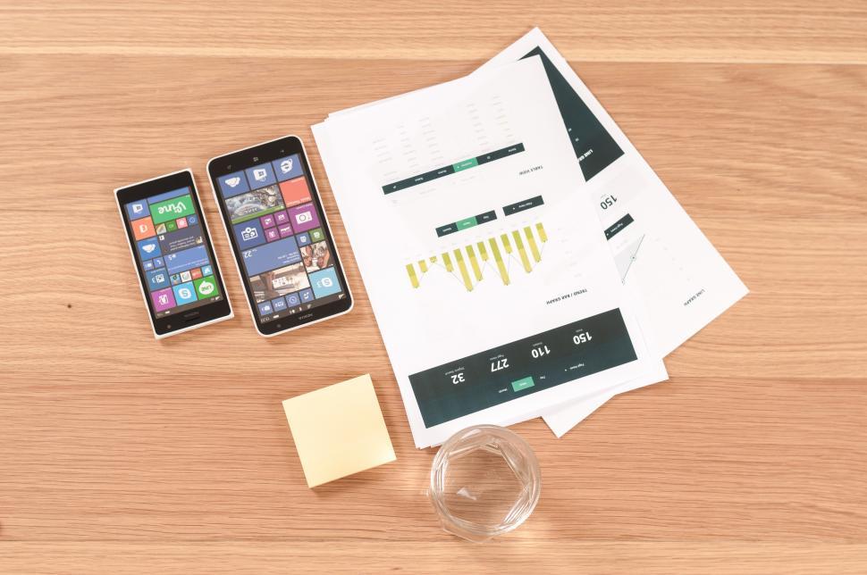 Free Image of Two mobile devices and reprorts 