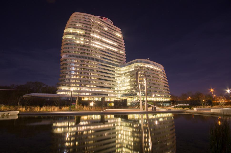 Free Image of Tall Building Next to Water 
