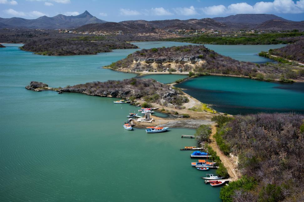 Free Image of Group of Boats Floating on Top of a Lake 