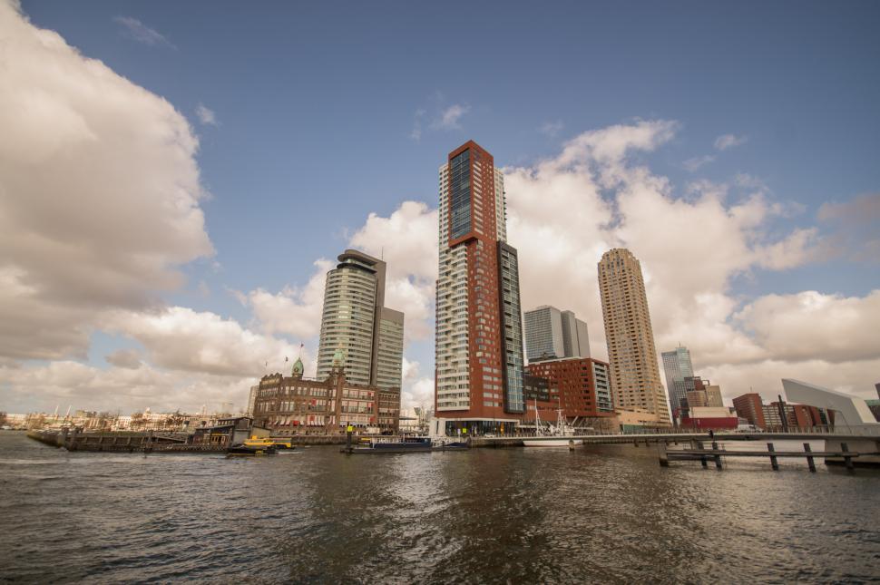 Free Image of Urban Skyline Reflected in Vast Body of Water 