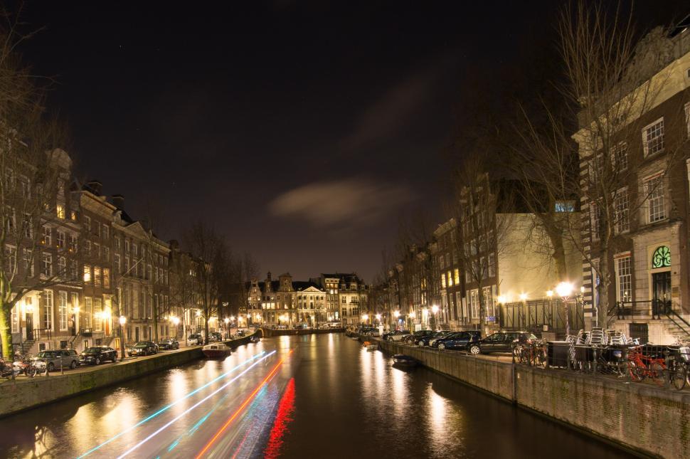 Free Image of River Running Through City Next to Tall Buildings 