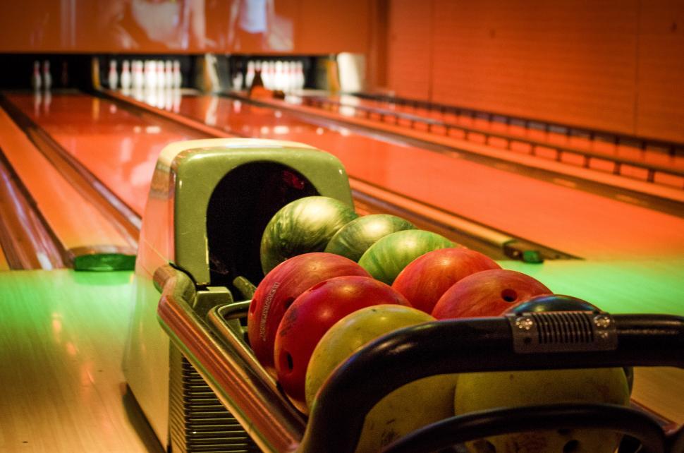 Pin, shoes and ball on alley in bowling club. Space for text Stock