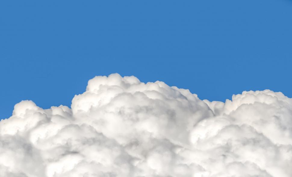 Free Image of Plane Flying Through Cloud Filled Sky 