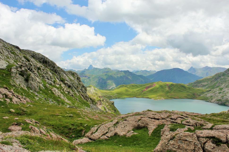 Free Image of Lake Nestled Within Majestic Mountain Range 