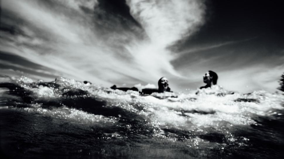 Free Image of People Riding Surfboards 