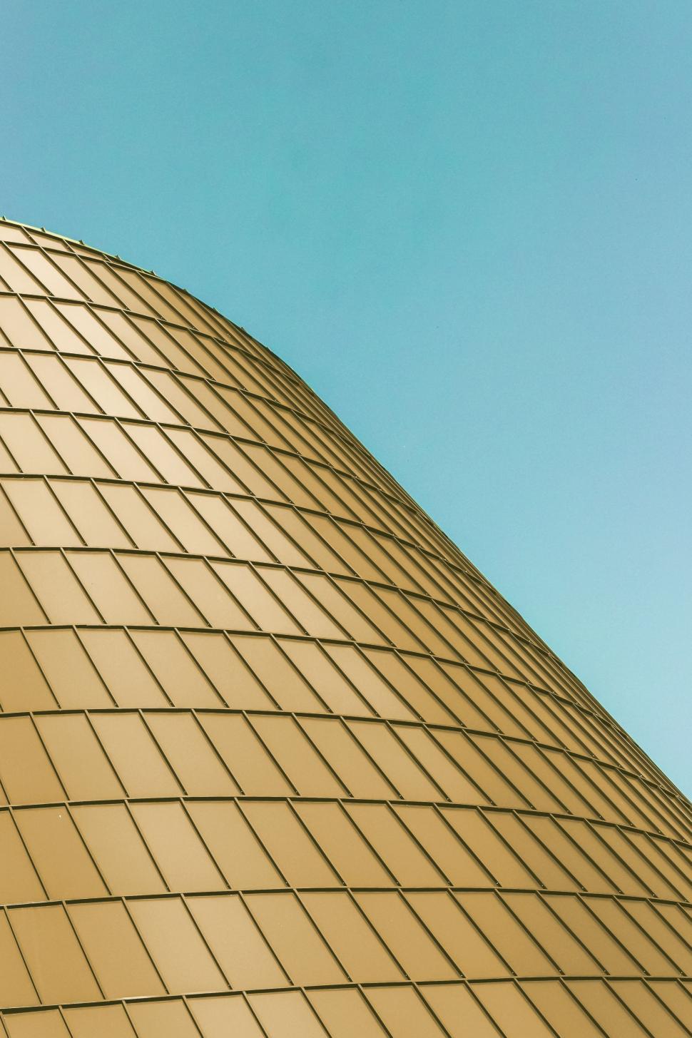 Free Image of Tall Building With Clock on Side 