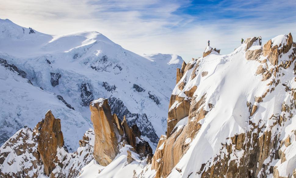 Free Image of Man Skiing Down Snow-Covered Mountain 