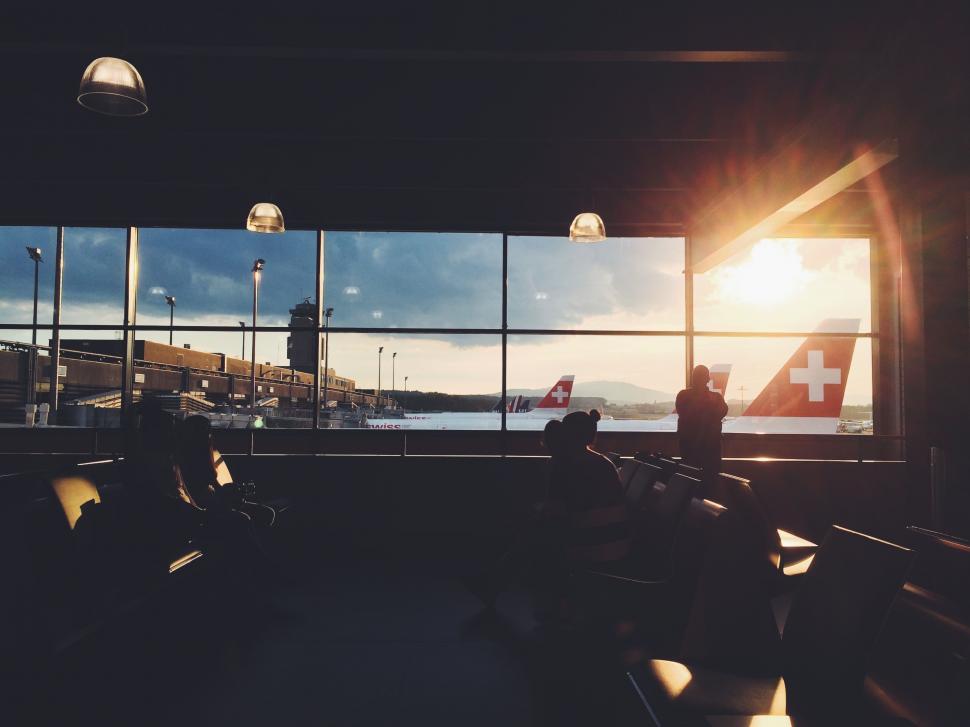 Free Image of Person Standing in Front of Large Window 